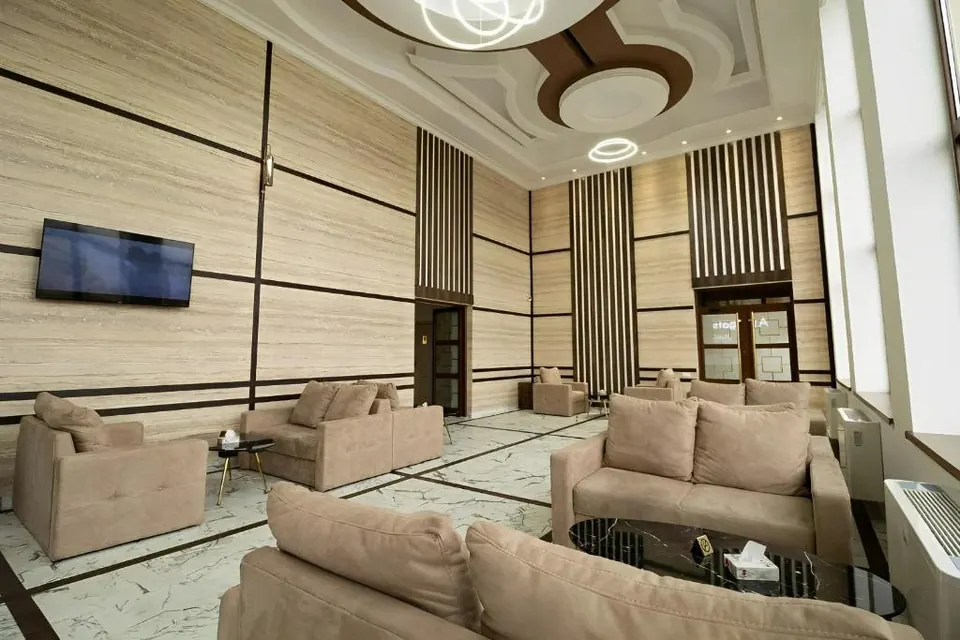 Lobby lounge with sofas and a television