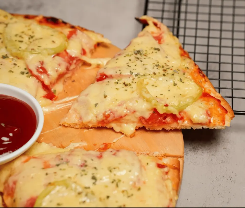 Freshly baked pizza with melted cheese